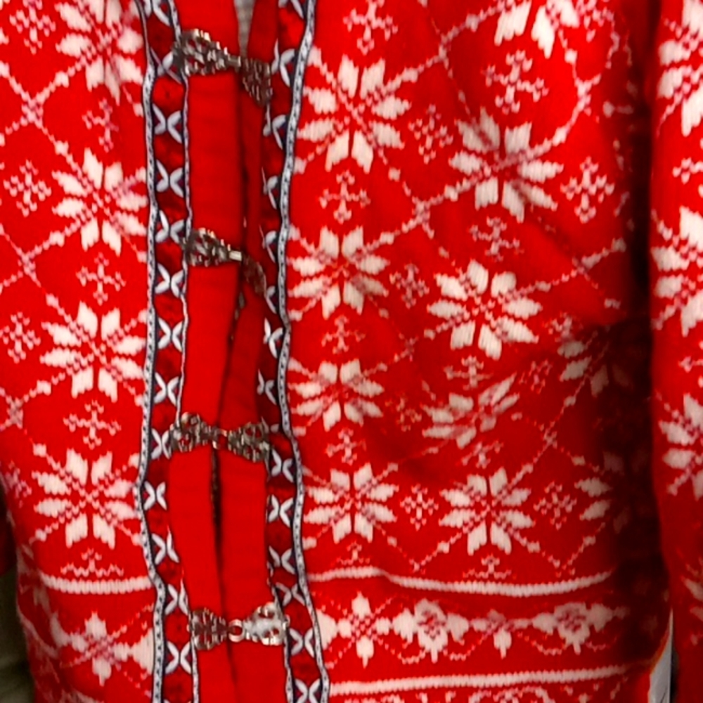 A knitted coat think with6 silver buckles